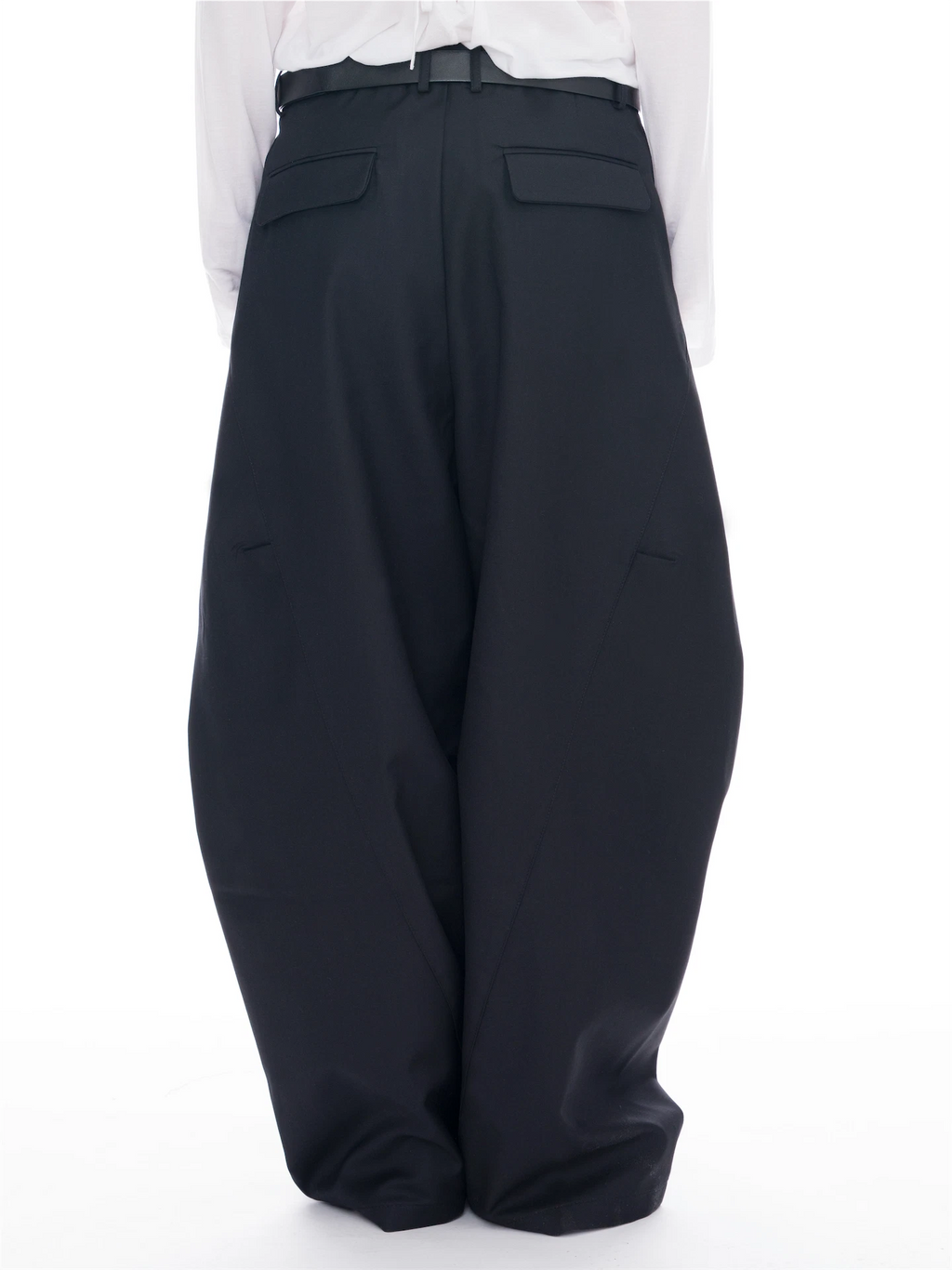 Black wide-leg trousers with a belt and flap back pockets, shown on a model from the back wearing a white shirt against a white background.