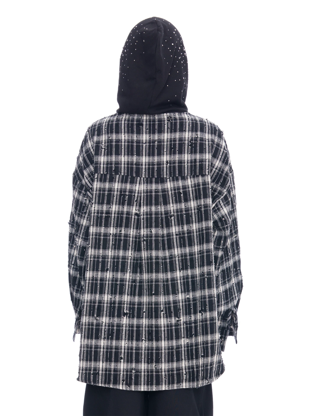 A person shown from the back wearing a black and white plaid hooded shirt with distressed details and a black hood, photographed against a plain white background.